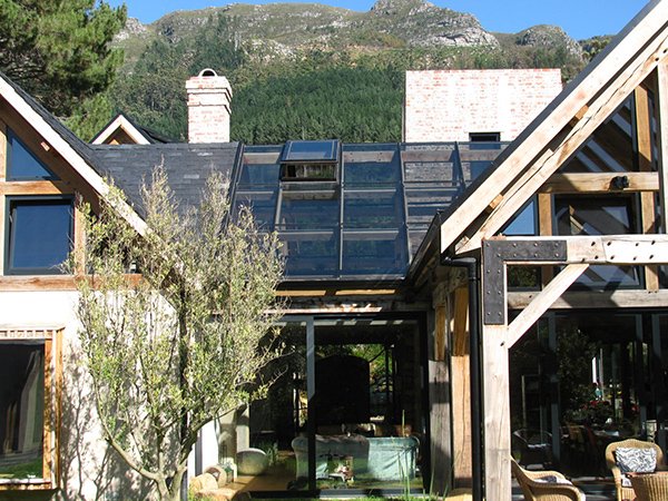 Pitched roof conservatory in charcoal with wood